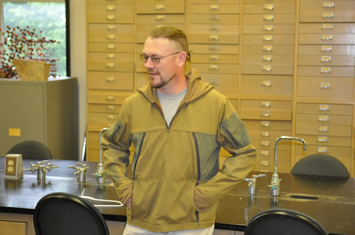 Alan Whittington, chair of the Department of Geological Sciences at the MU College of Arts and Science, tries on the jacket of the lava suits created by Abby Romine