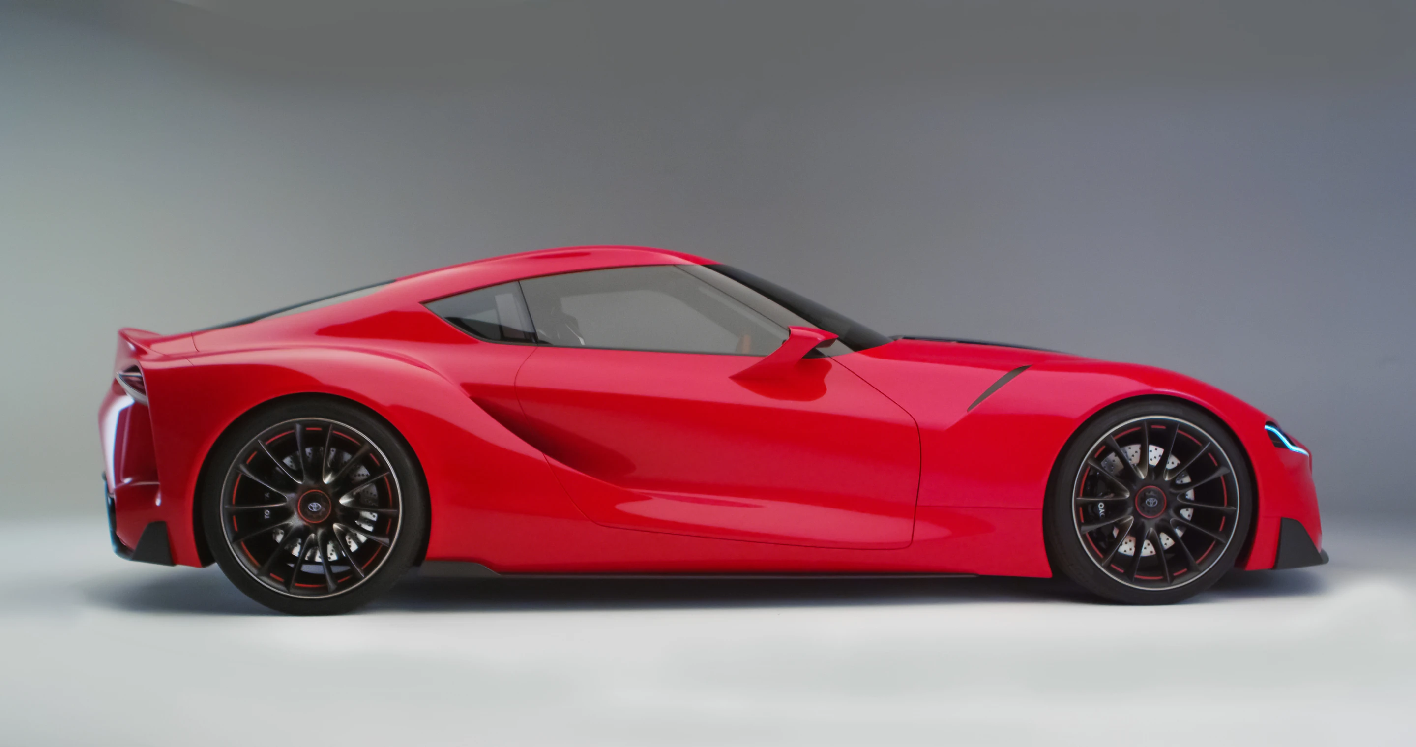 Toyota pushed the cabin back and carved and sculpted the flank to give the FT-1 a memorable profile