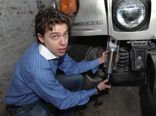 Zack Anderson, senior in elecrical engineering, with the GenShock prototype (Photo:Donna Coveney via MIT)