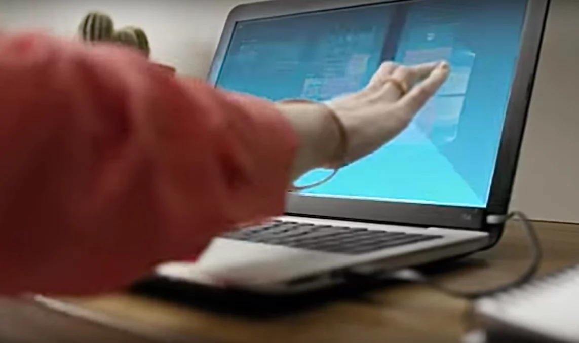 The AirBar works by sensing breaks in a light field it emits across the entire laptop screen