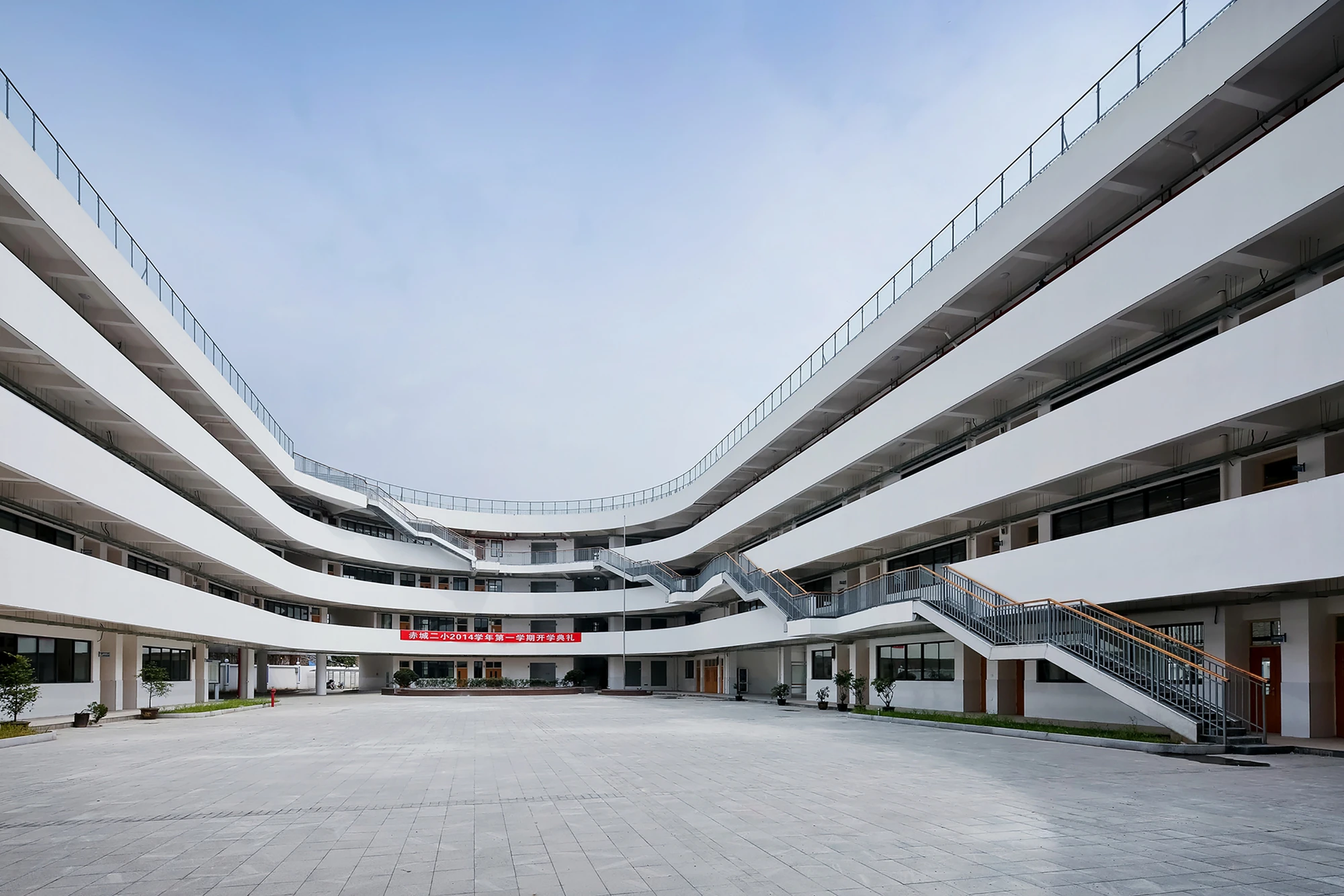 In an effort to reduce kinetic noise throughout the building below, spring cushions have been dispersed beneath the all-weather running track
