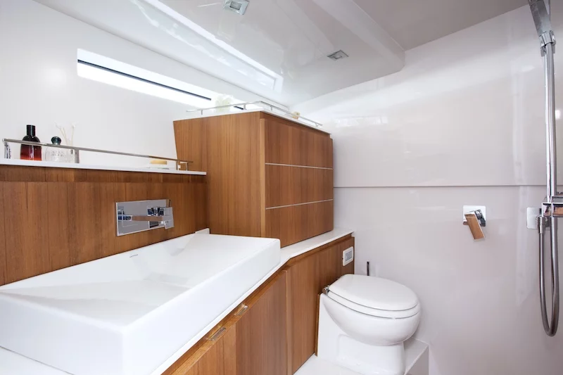 The bathroom includes toilet, sink and full-height shower