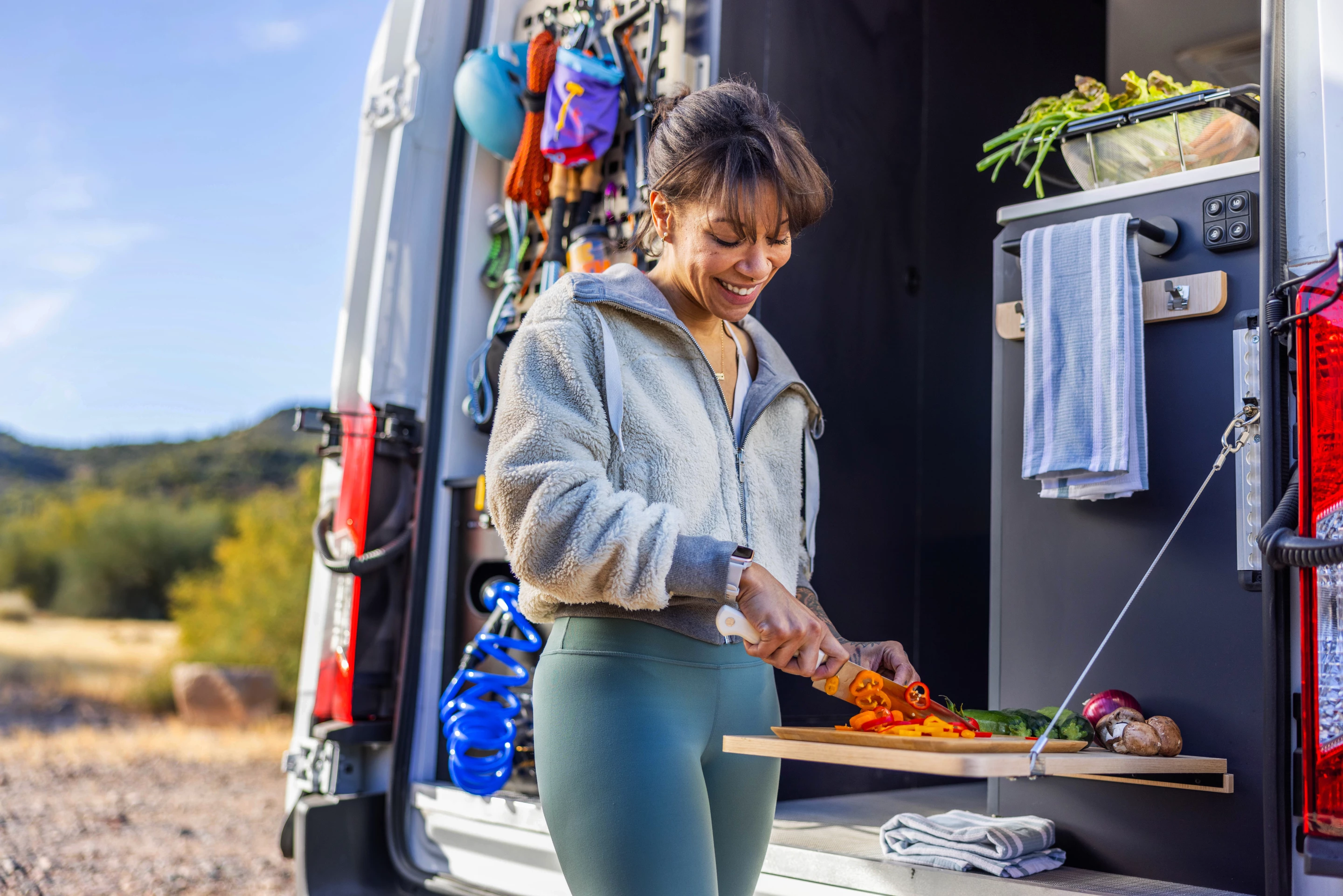 Like some of Winnebago's side door kitchens, the e-RV rear kitchen includes an adjustable, drop-down worktop for indoor/outdoor cooking