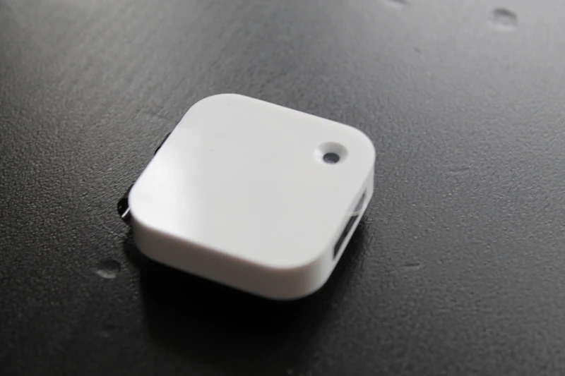 The camera lens is on the front corner of the device