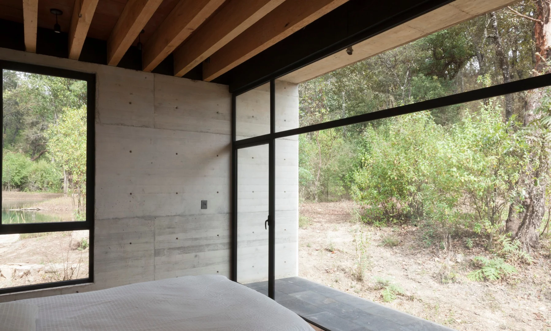 Each end of the Y-shaped Casa de la Roca has a room with a floor-to-ceiling window