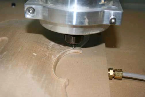 Photograph of the CNC machine carving the front plate of the Betts violin reproduction. (Photo: RSNA)