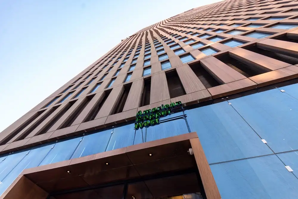 The American Copper Buildings are clad in 4.25 million pounds (1.9 m kg) of raw copper