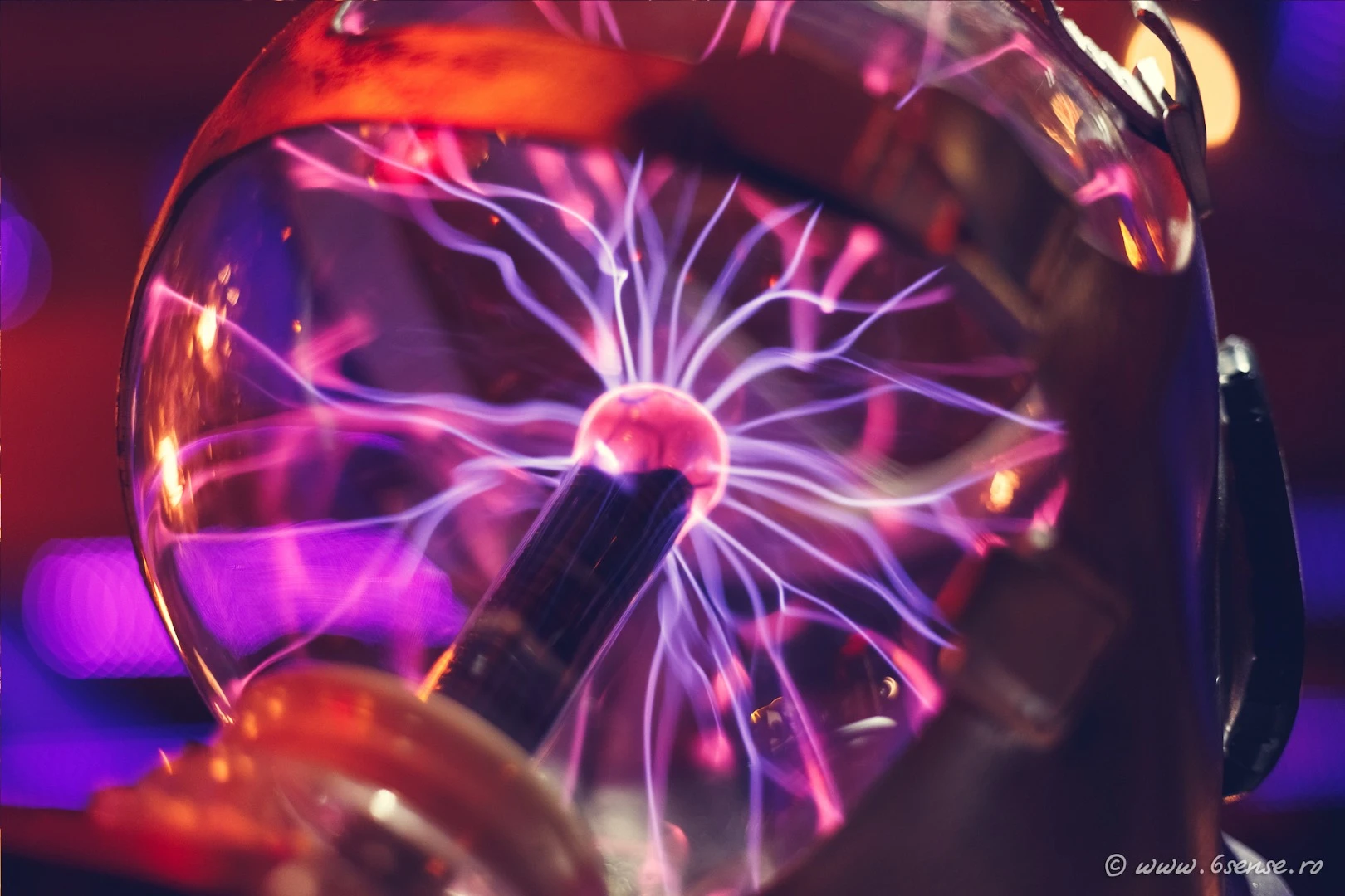 The "time slave" is a forlorn figure riding a bicycle, wearing a gas mask, and with a plasma globe in place of a brain