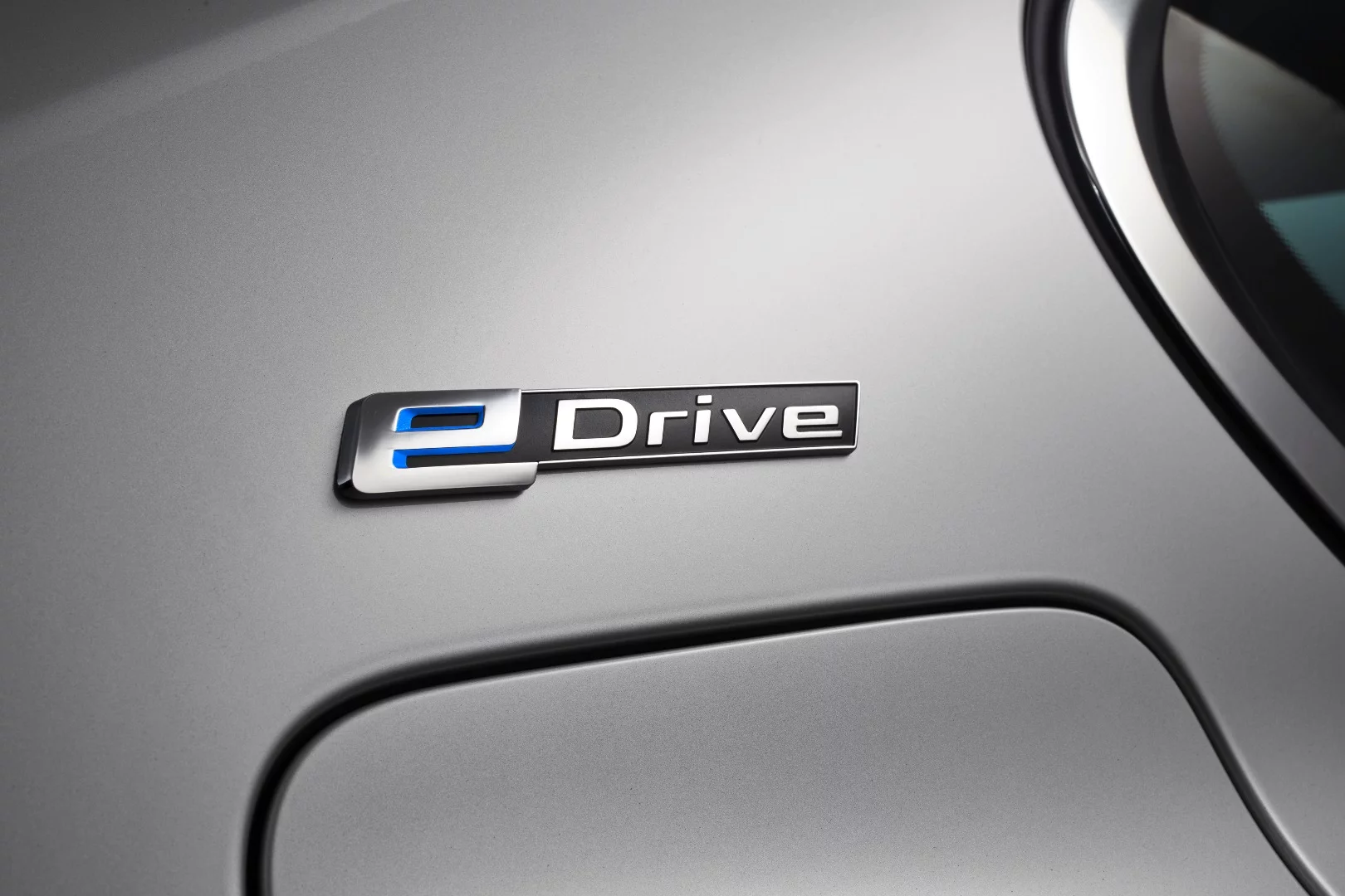 The eDrive logo on the rear pillar denotes the car's plug-in status
