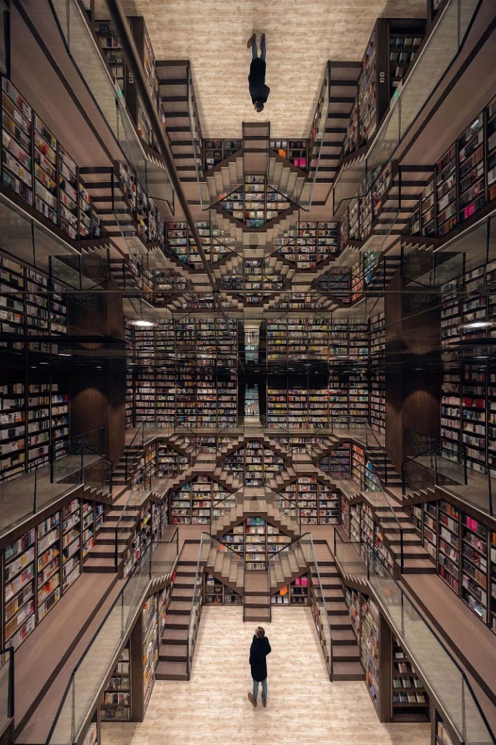 A reflective ceiling tops the huge main study inside the Chongqing Zhongshuge Bookstore