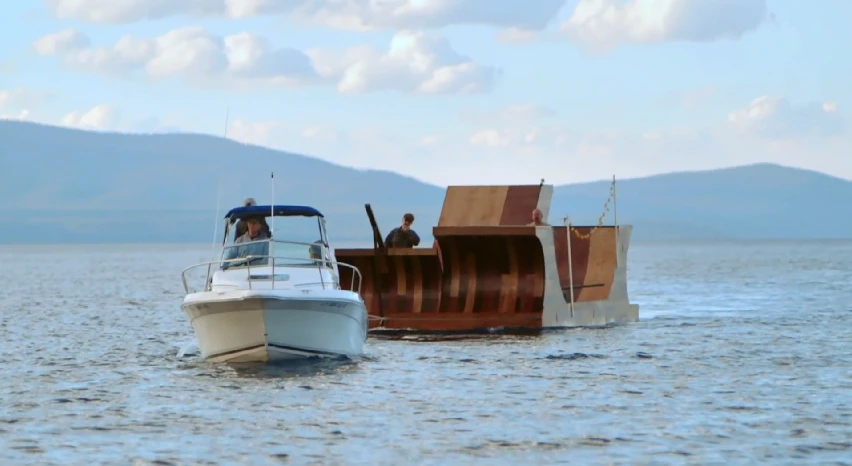 The floating ramp gets towed to location
