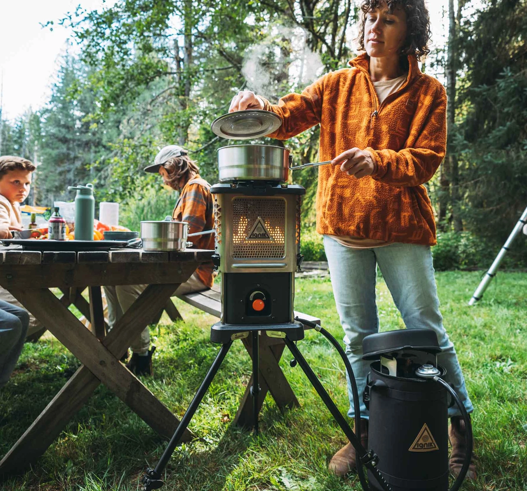 The Ignik Skullet Deluxe includes a tripod for a higher heat/cooking level