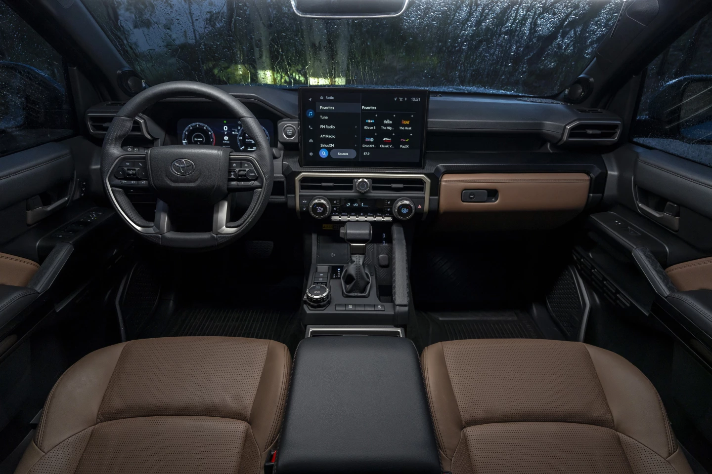 Inside, the 4Runner retains the "vampire tooth" steering wheel design, passenger "OMG bar" by the shifter, and other 4Runner staples
