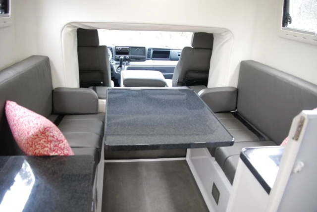 The dinette set transforms into a single bed