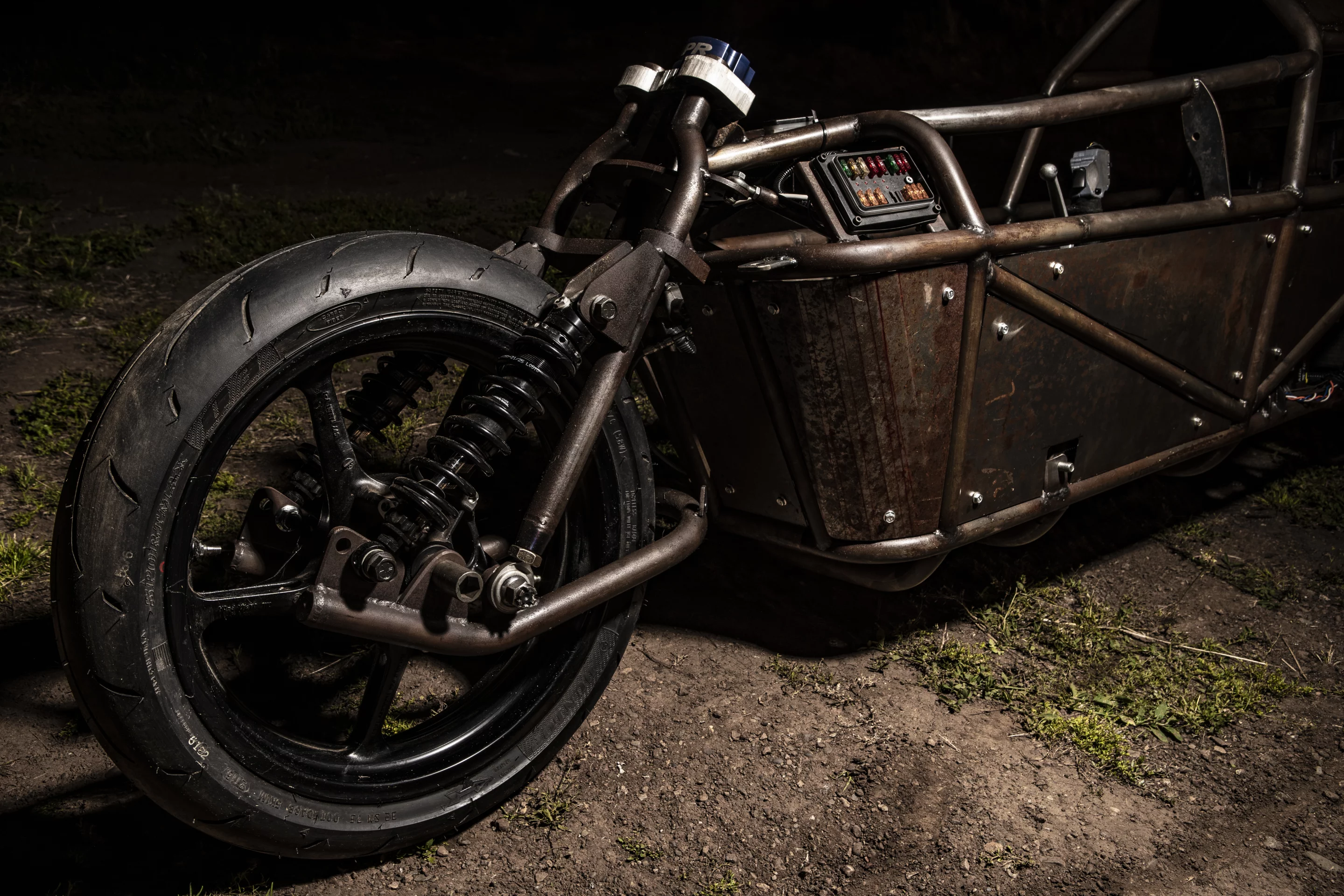 Nyquist's scooter-like front suspension setup, designed out of necessity to leave him some space to see over the top triple clamps