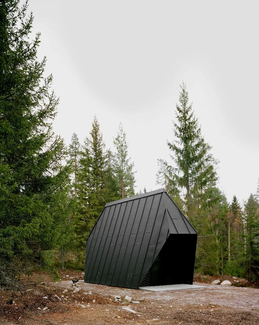 There's a small storage building in a similar style nearby