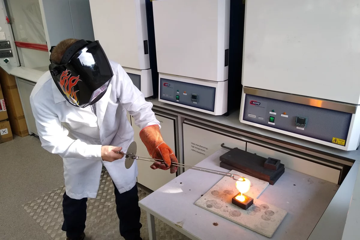 Rods of the material are formed by pouring molten glass into molds