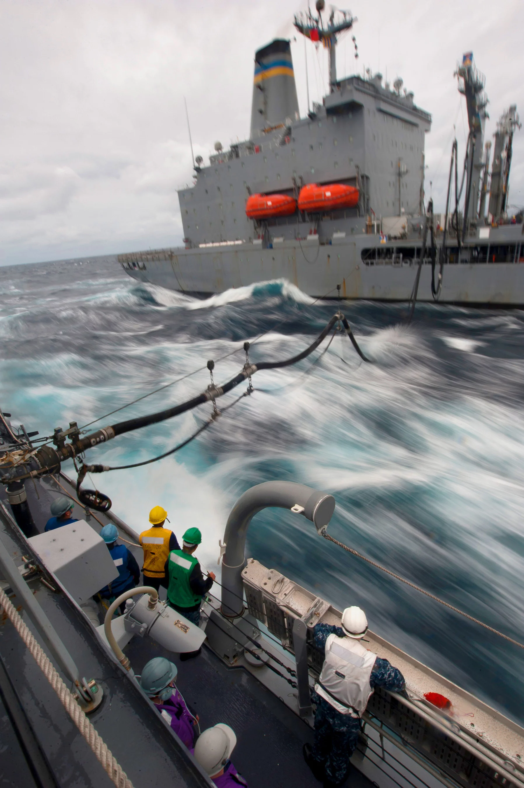 A U.S. Navy ship being refueled at sea