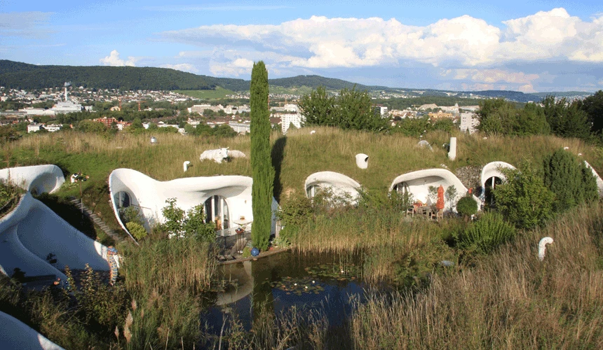 Peter Vetsch, a dominant force in earth house architecture, has built over 90 energy saving underground houses, with a strong nod to the organic forms of Gaudi