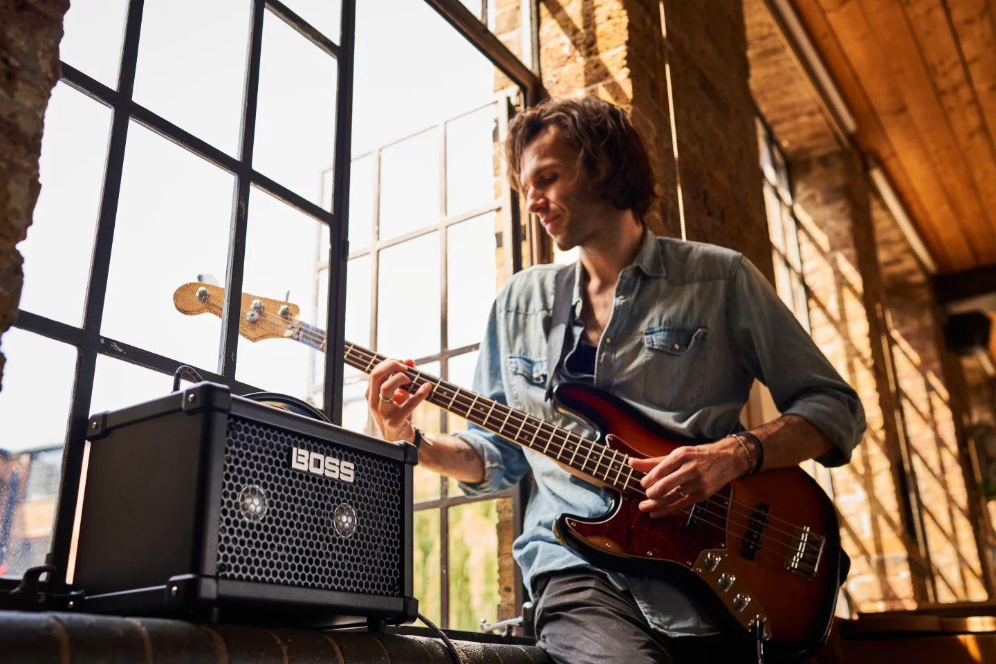 The Dual Cube Bass LX practice amp can be powered by AA-sized batteries or the supplied AC adapter