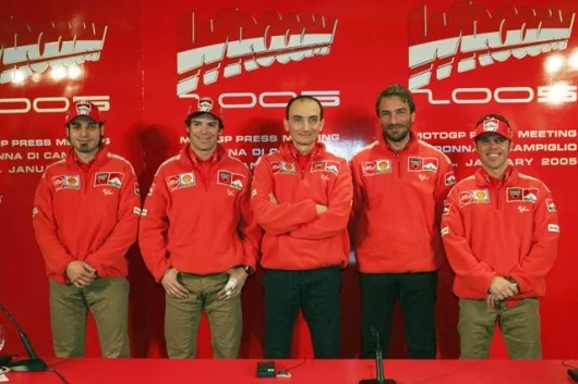 The 2005 team lines up to face the media