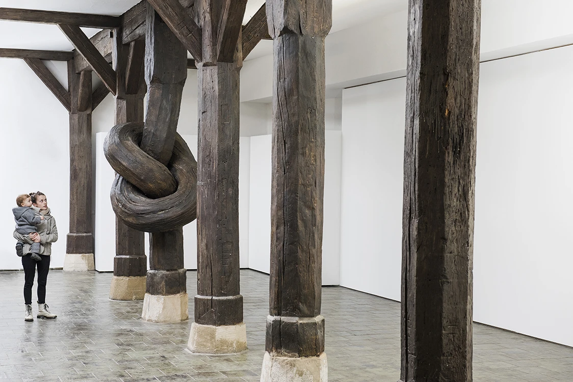Birth, death and a midlife crisis slips a knotted, logic-defying wooden pillar into an old building