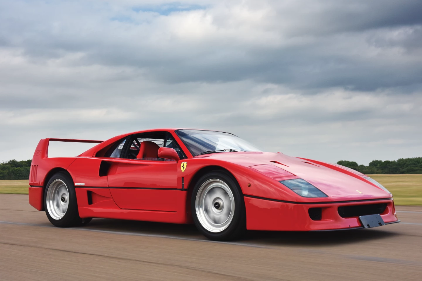 Launched in 1987, the Ferrari F40 was the first road legal production car to break the 200 mph with a top speed of 201.4 mph (324 km/h), making it the world's fastest production car. 1987 was also Enzo Ferrari's 90th birthday, and it was 40 years since he built his first Ferrari automobile so the evolution of the 288 GTO destined for a racing class that was made defunct became a special supercar and the last one "il Commendatore" would see launched. Only 1,311 F40s were produced between 1987 and 1996, and as they come to auction, they now invariably fetch more than a $1,000,000, hence it's not surprising that RM-Sotheby's 1992 Ferrari F40 fetched £845,600 ($1,292,037)