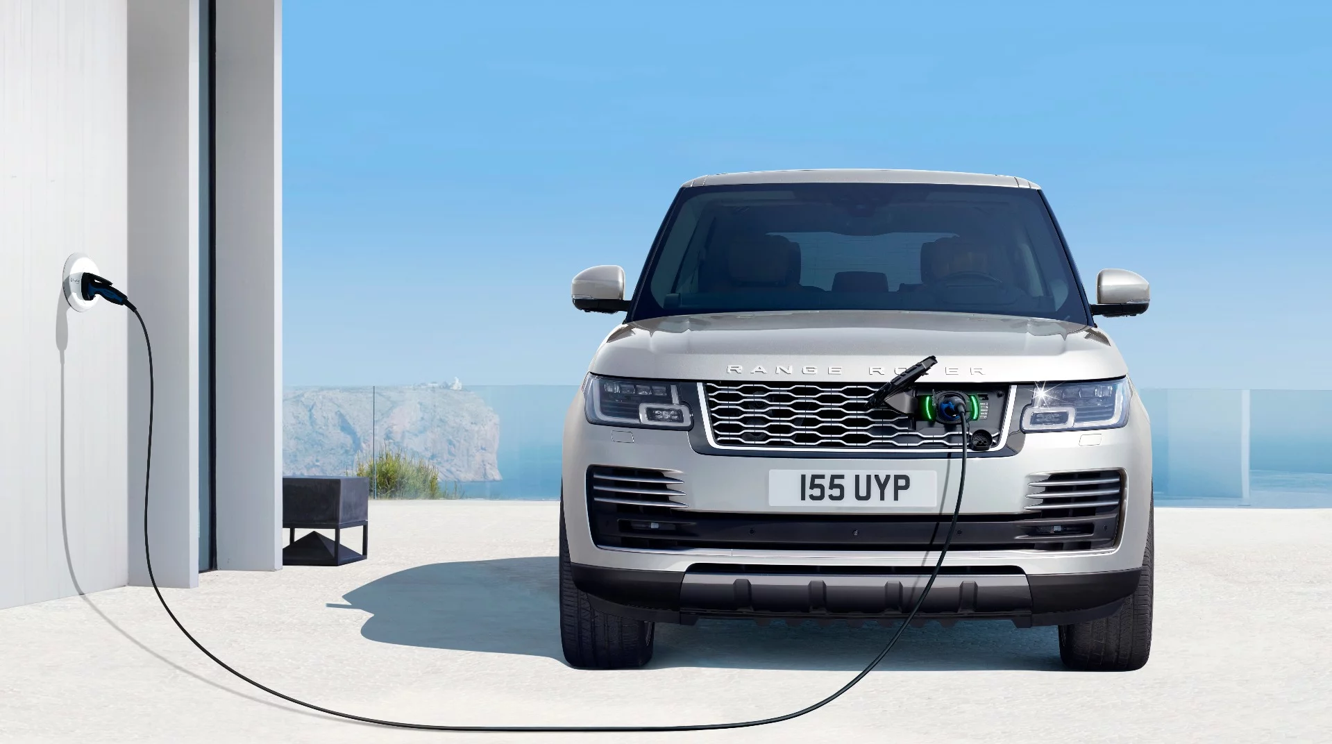 The recharge socket on the Range Rover P400e is hidden behind a Land Rover badge on the front grille