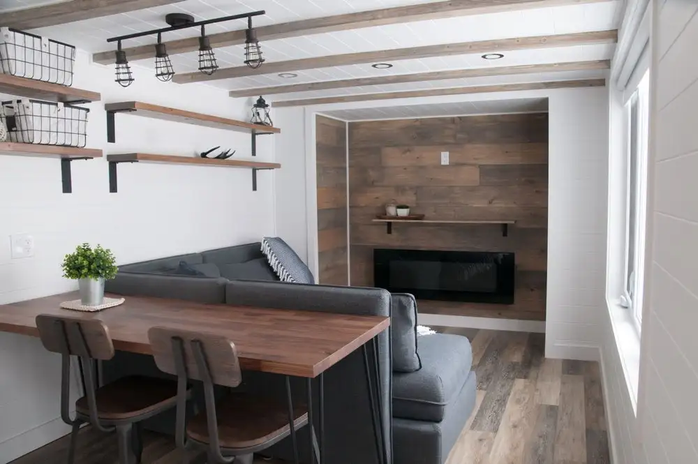 The Ébène's living room includes a large storage-integrated sofa