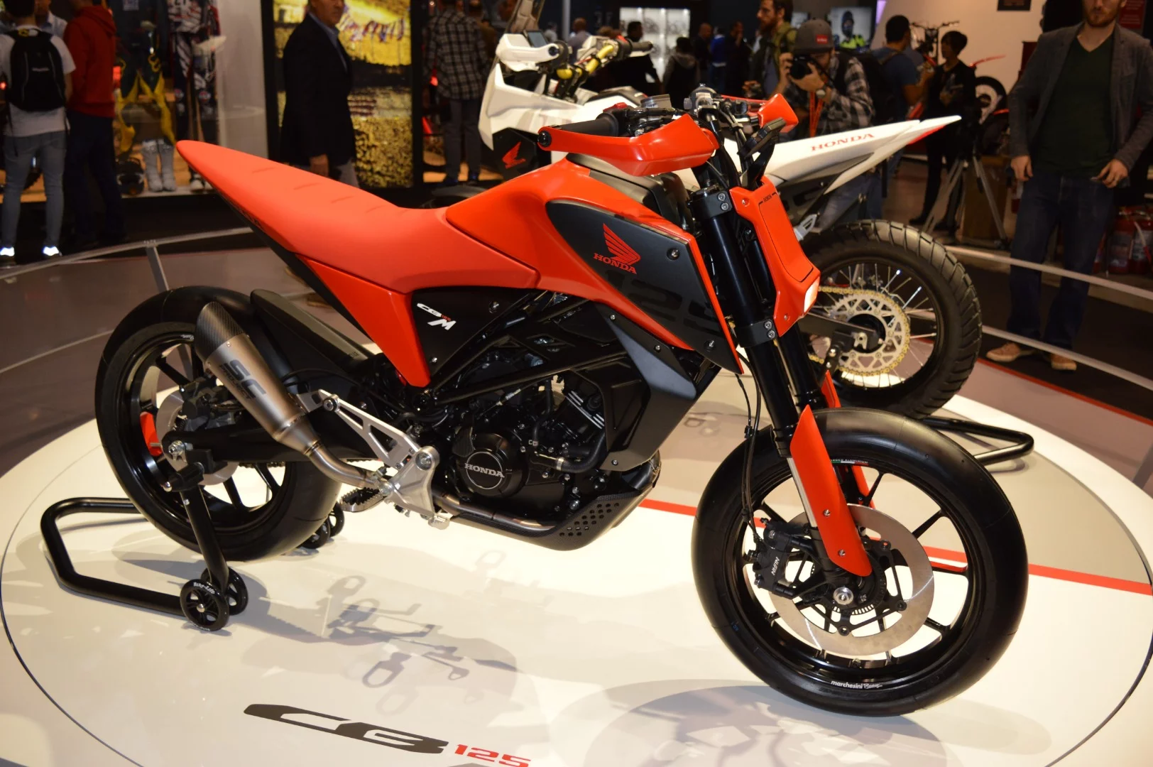 As the 125 cc class explodes in popularity in Europe, Honda showed two concept bikes based on the CB125 motor, both styled by Valerio Aielo and his Italian designers' team. This is the supermoto-themed CB125M