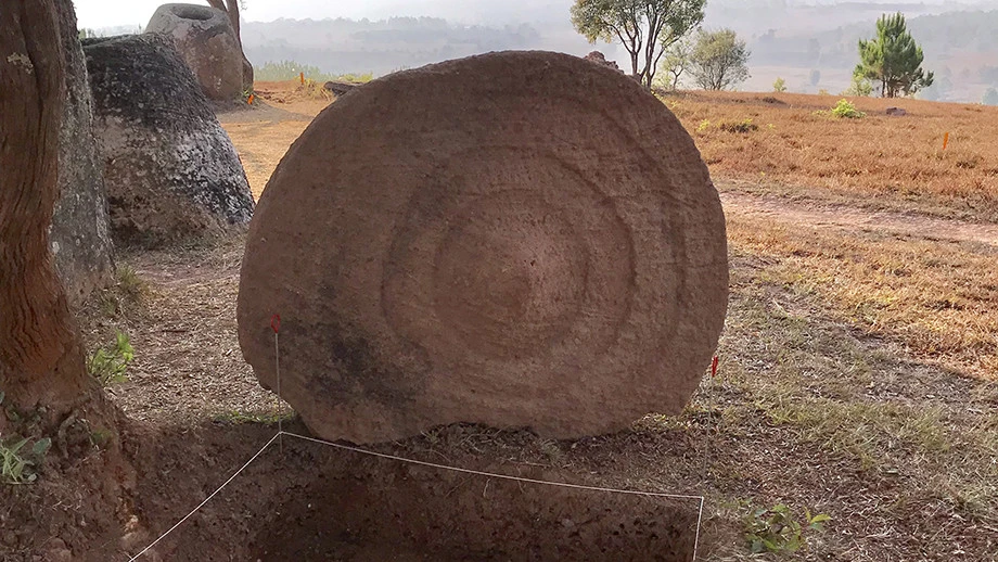The decorative discs are too large and heavy to be lids for the stone jars, leading the team to suspect they were uses as burial markers