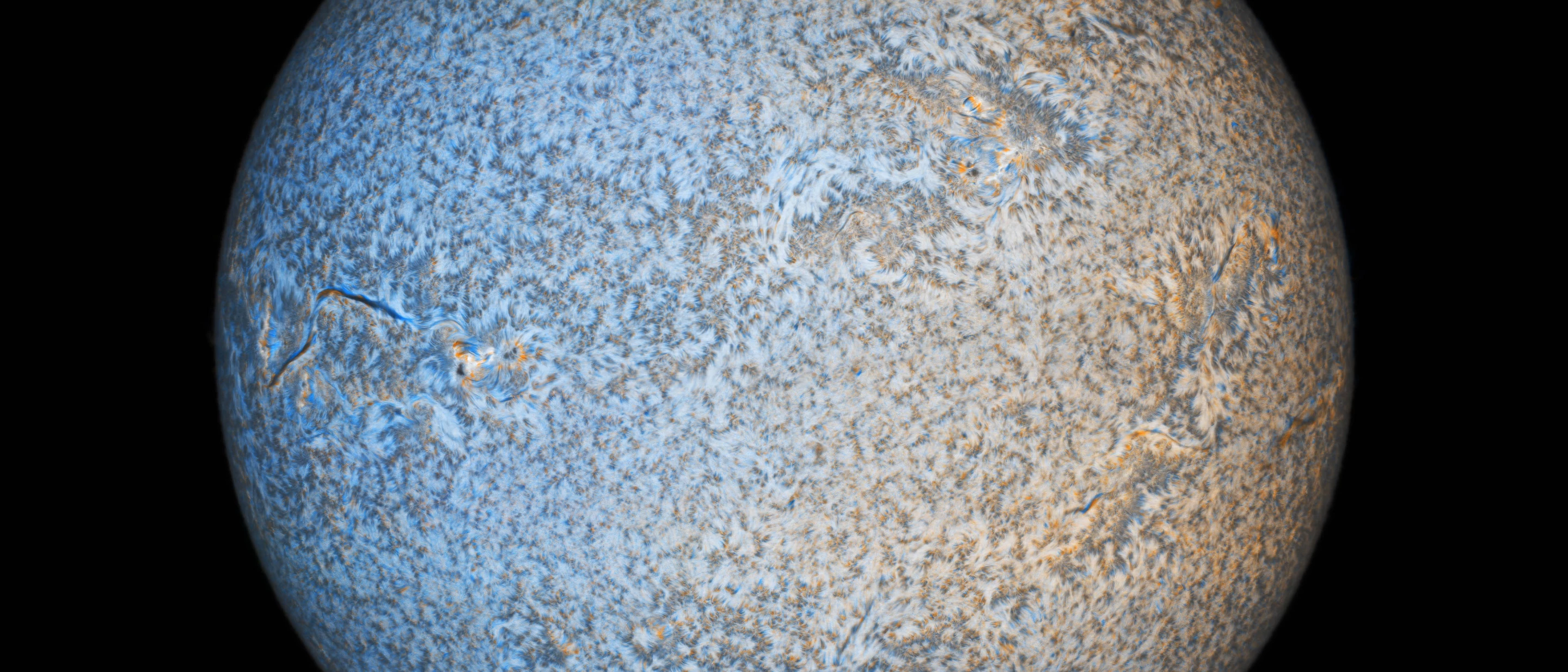 Our Sun Highly Commended: Blue turns to Red, our Sun Rotates © Andras Papp (Hungary). Image processing contrasts sections of the Sun heading towards us (blue) and away from us (red)