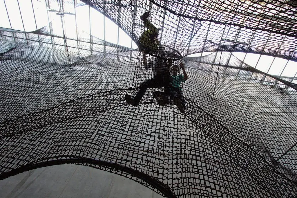 People pass between different sections of Net Linz