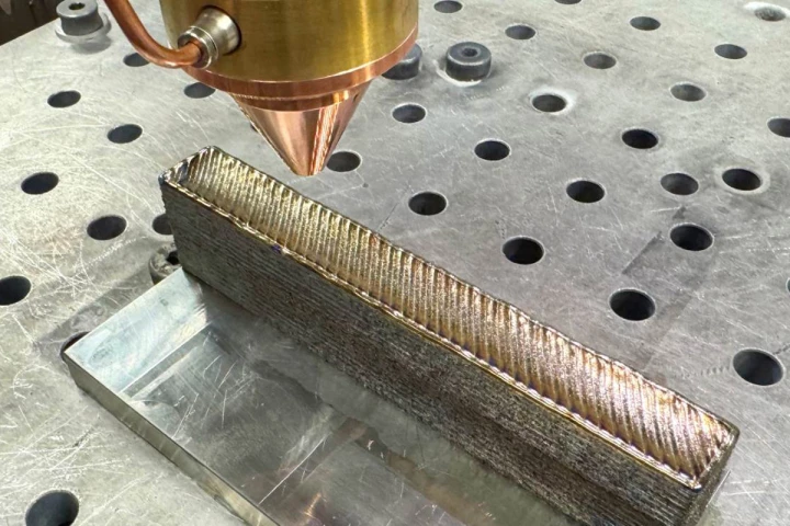 A titanium alloy being additively manufactured