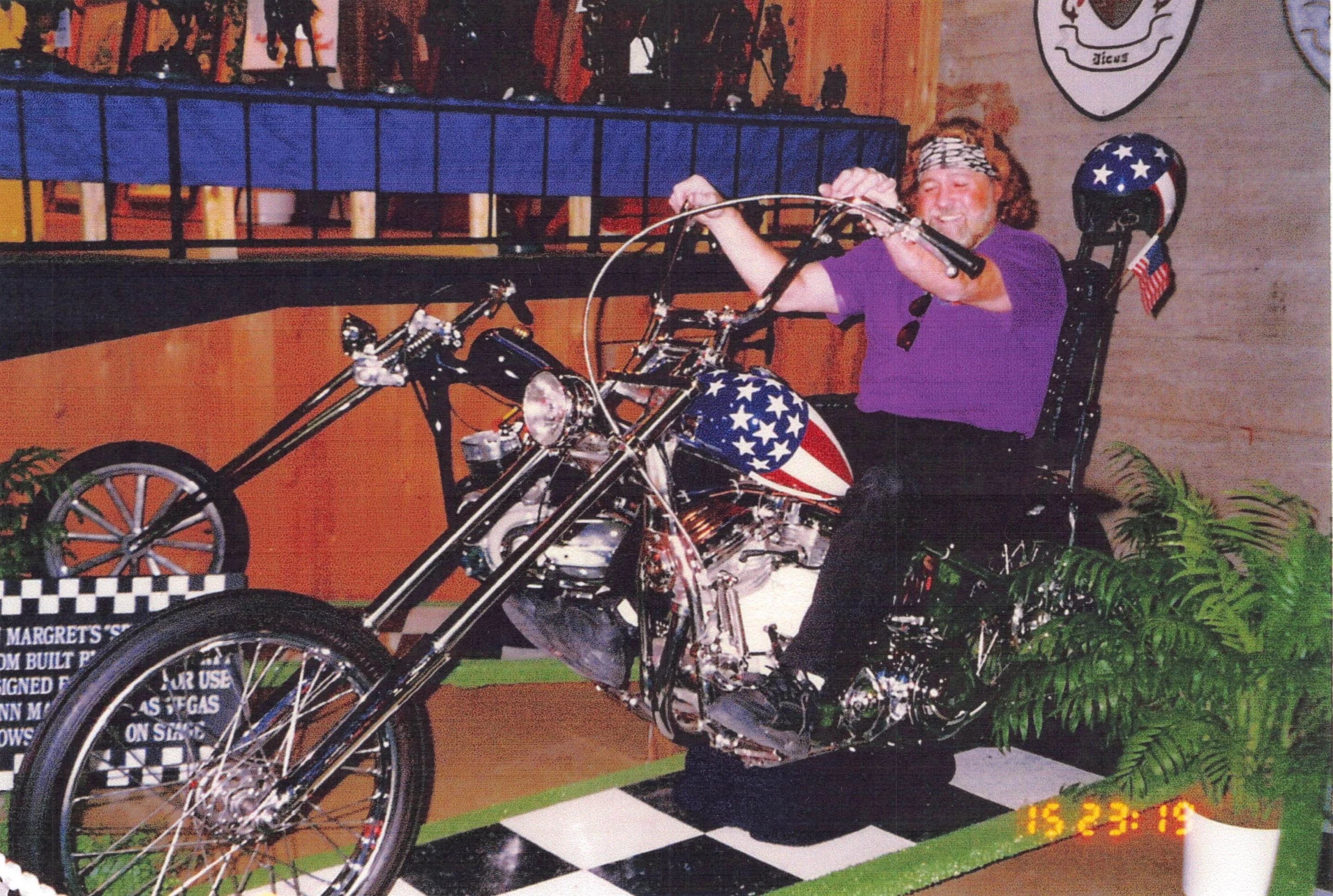 Dan Haggerty on the Captain America Harley-Davidson Panhead Chopper from the Gordon Granger Collection. This image was taken in the lead up to the 1996 auction of the machine by Dan Kruse Classics when the machine was sold by celebrity vehicle collector, Gary Graham, to Gordon Granger.