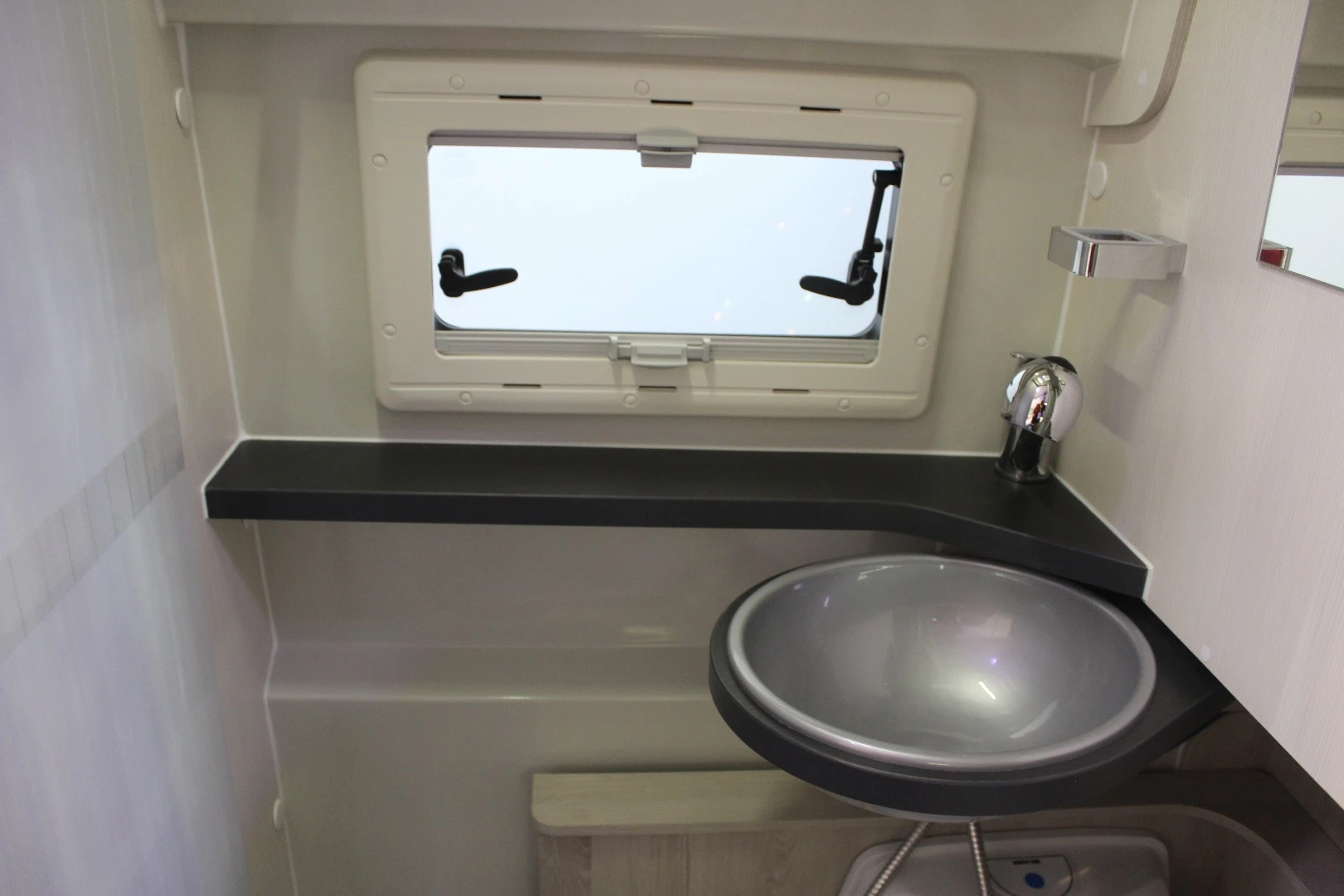 The Dexter 555 sink swivels out when needed and away for toilet access