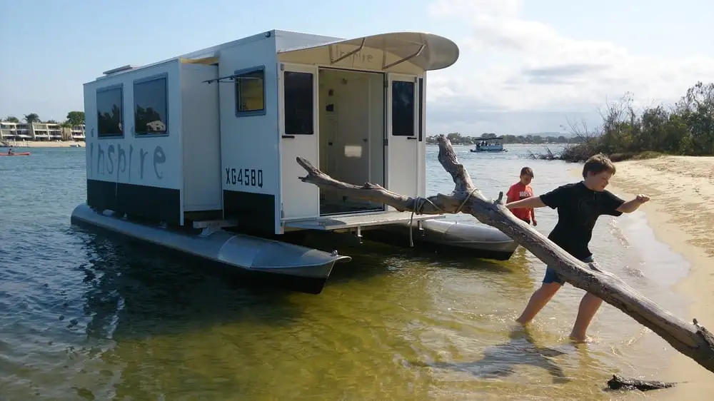 The side slide-outs increase interior space, and the pontoons move with them to keep things stable on the water