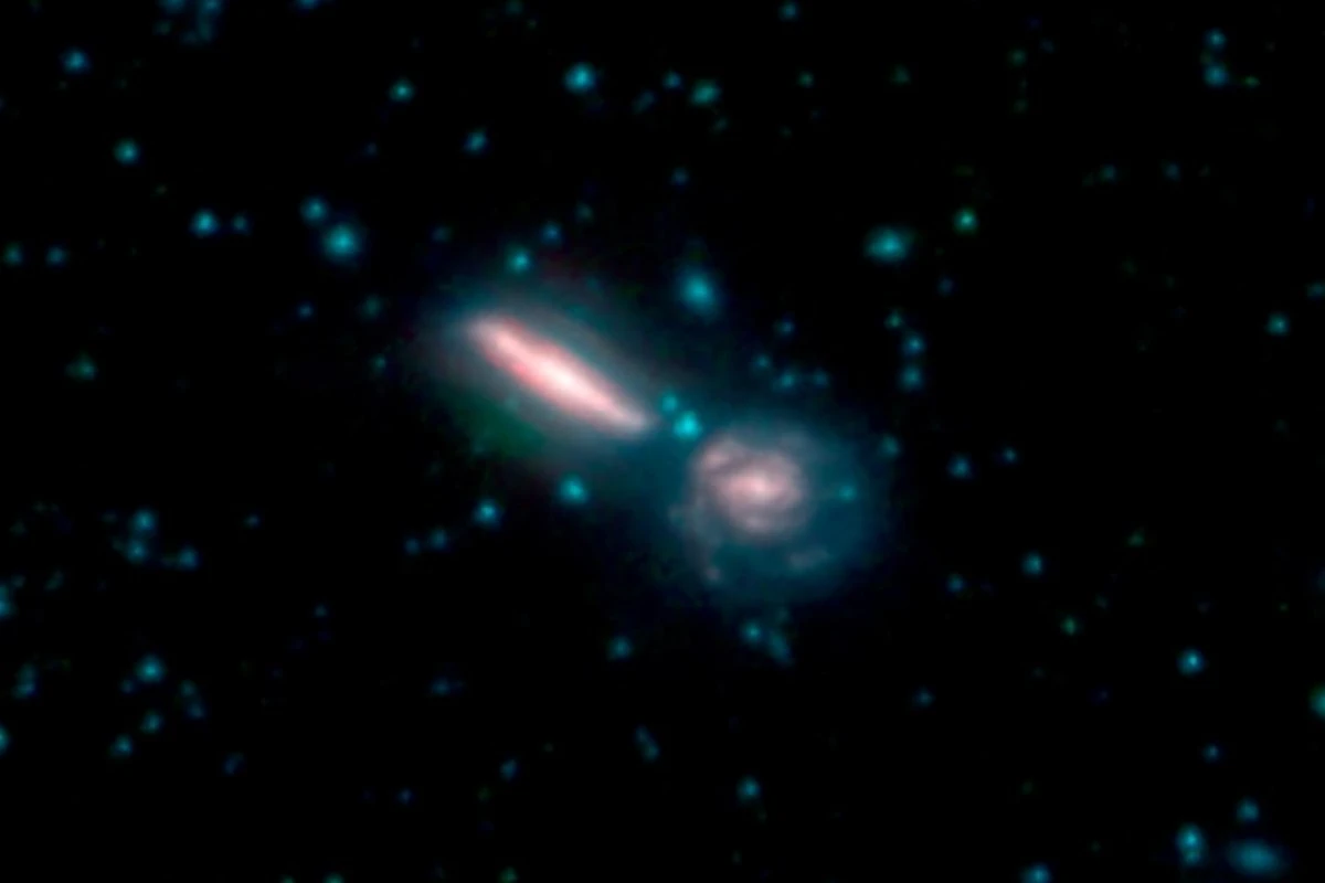 Two merging galaxies known as Arp 302, also called VV 340