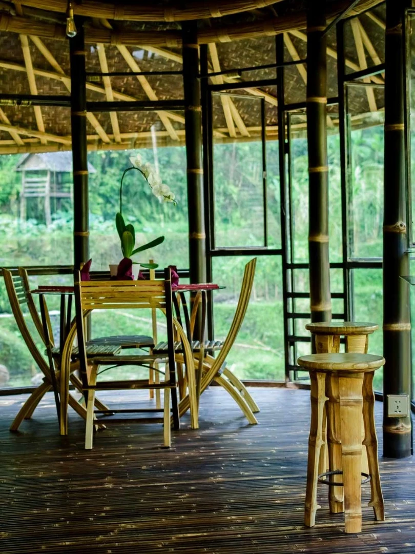 Balinese architecture firm Ibuku continues to build out its impressive portfolio of incredible bamboo luxury hotels, with the completion of a new riverside retreat in the thick of the jungle