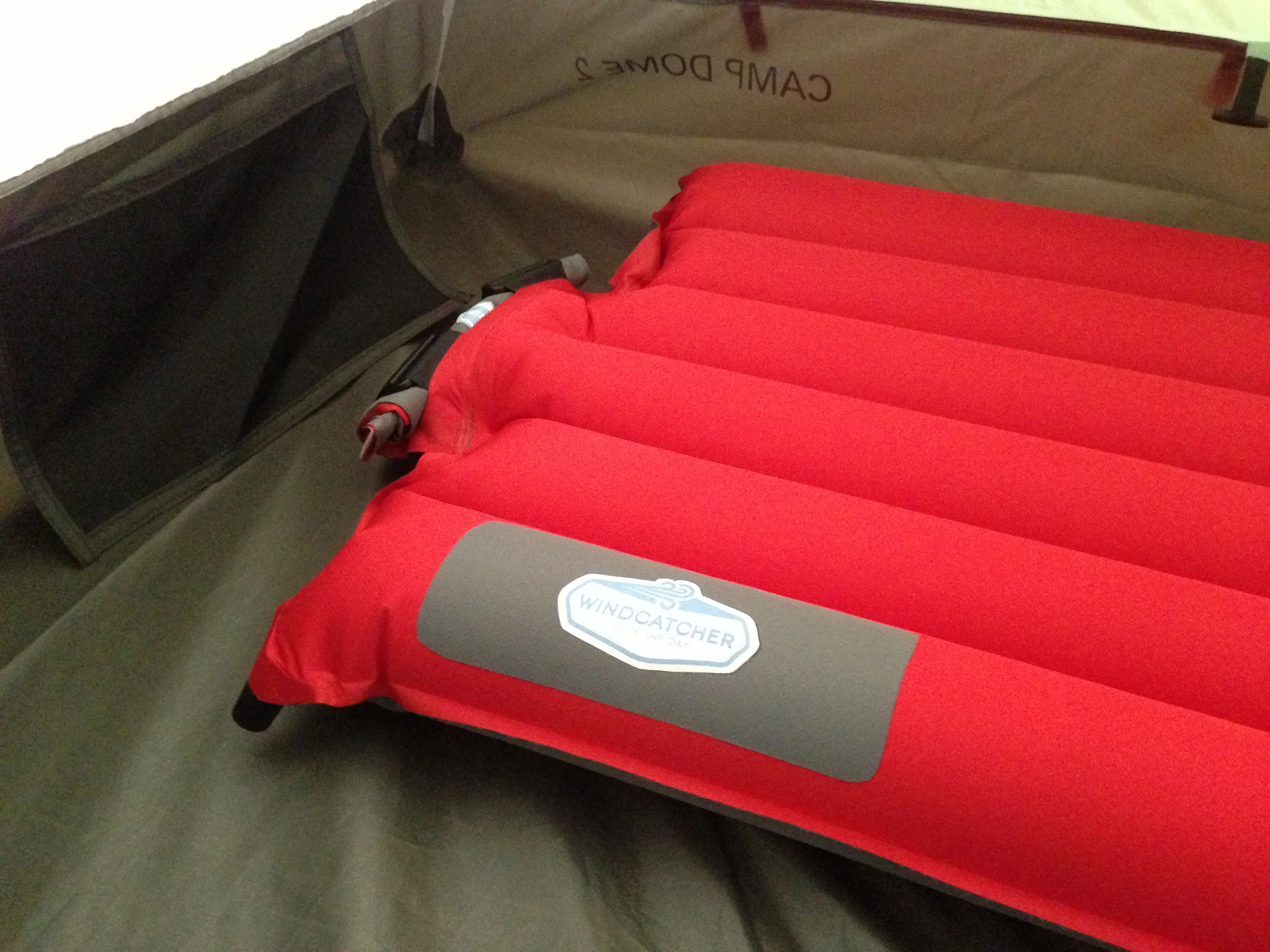 When it's fully inflated, rolling up the valve and securing it in place with Velcro straps ensures a tight seal