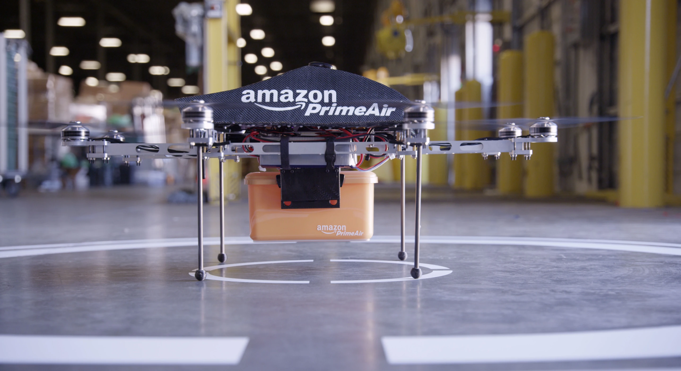 Orders are placed in small plastic containers and then carried by the custom-built "octocopter"