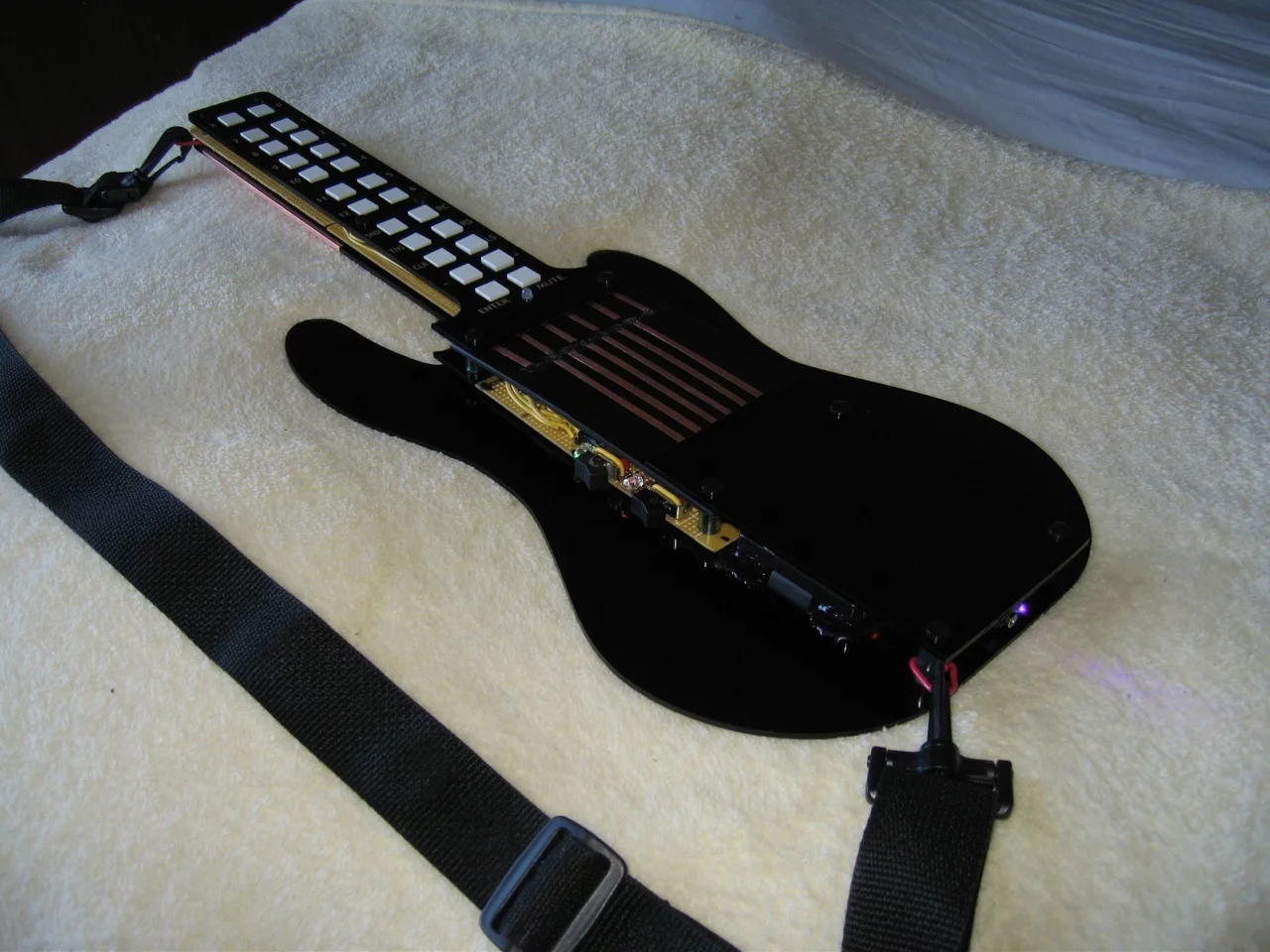 A later version looking closer to the current pre-production prototype - black acrylic with working electronics on protoboards