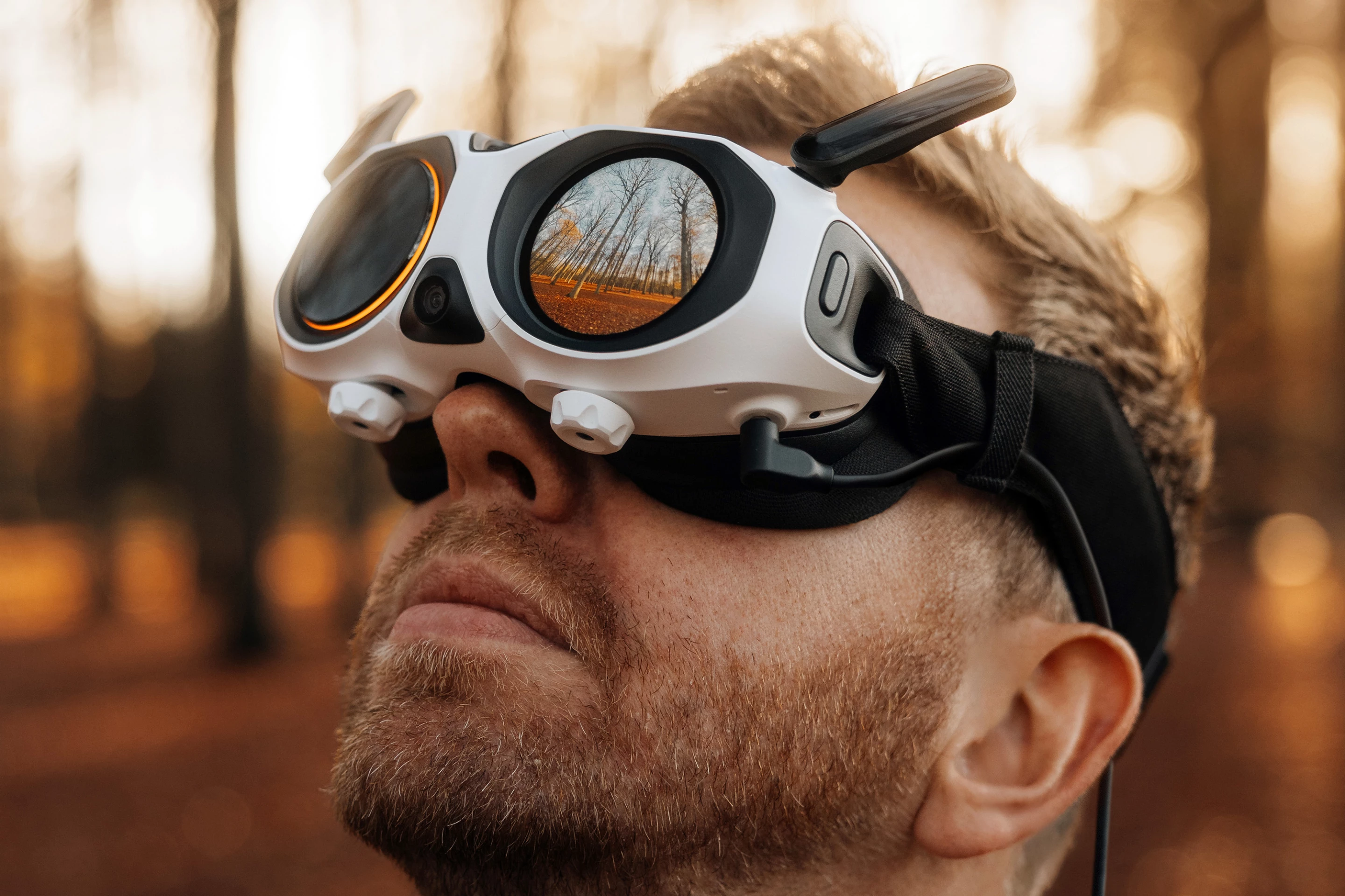 Passerby's can see what you see through the drone on the left side of the goggles. Super cool in theory, but difficult when the pilot is spinning in circles and looking straight down and the like