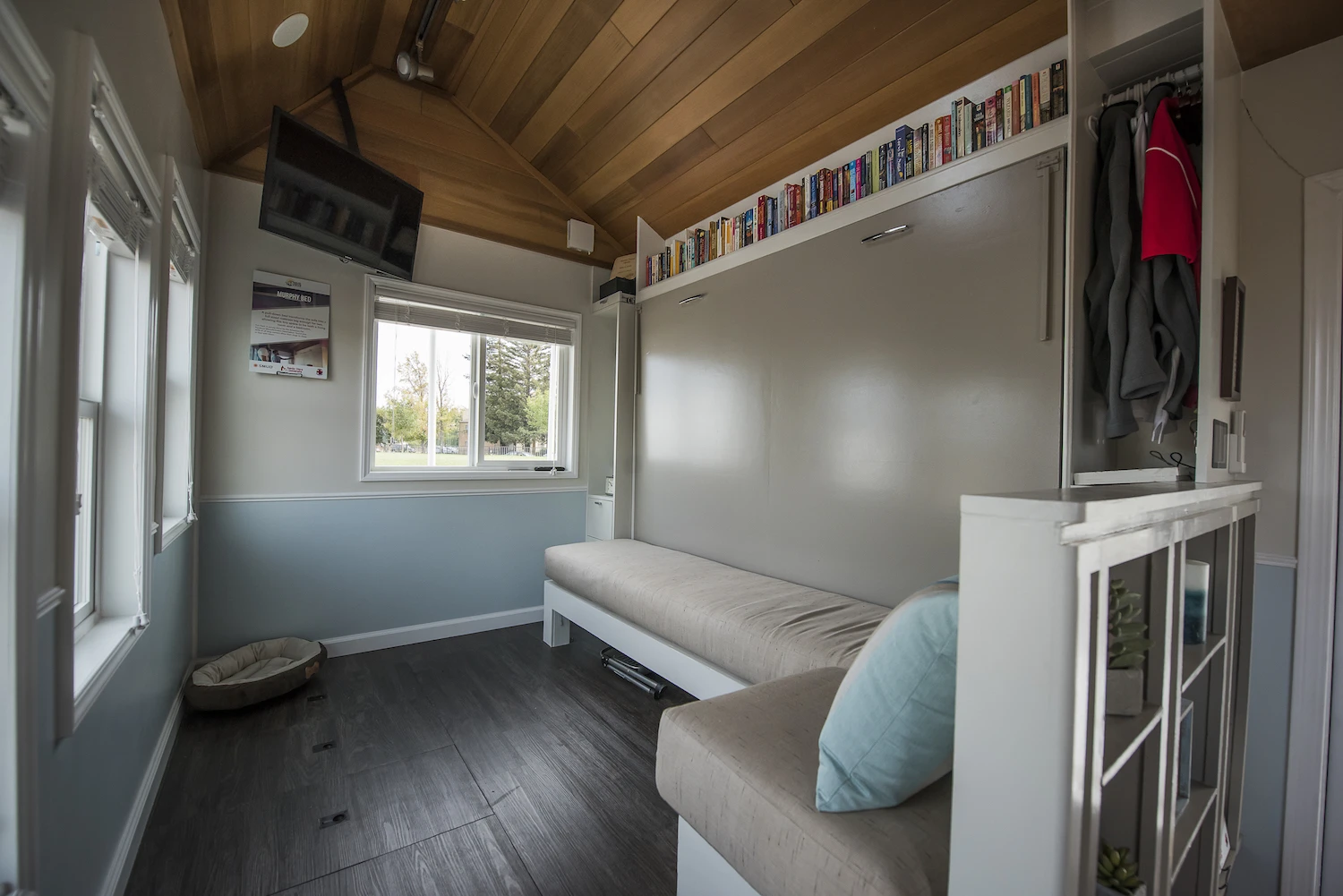 The Revolve House has a lounge area with a murphy-style pull-down bed