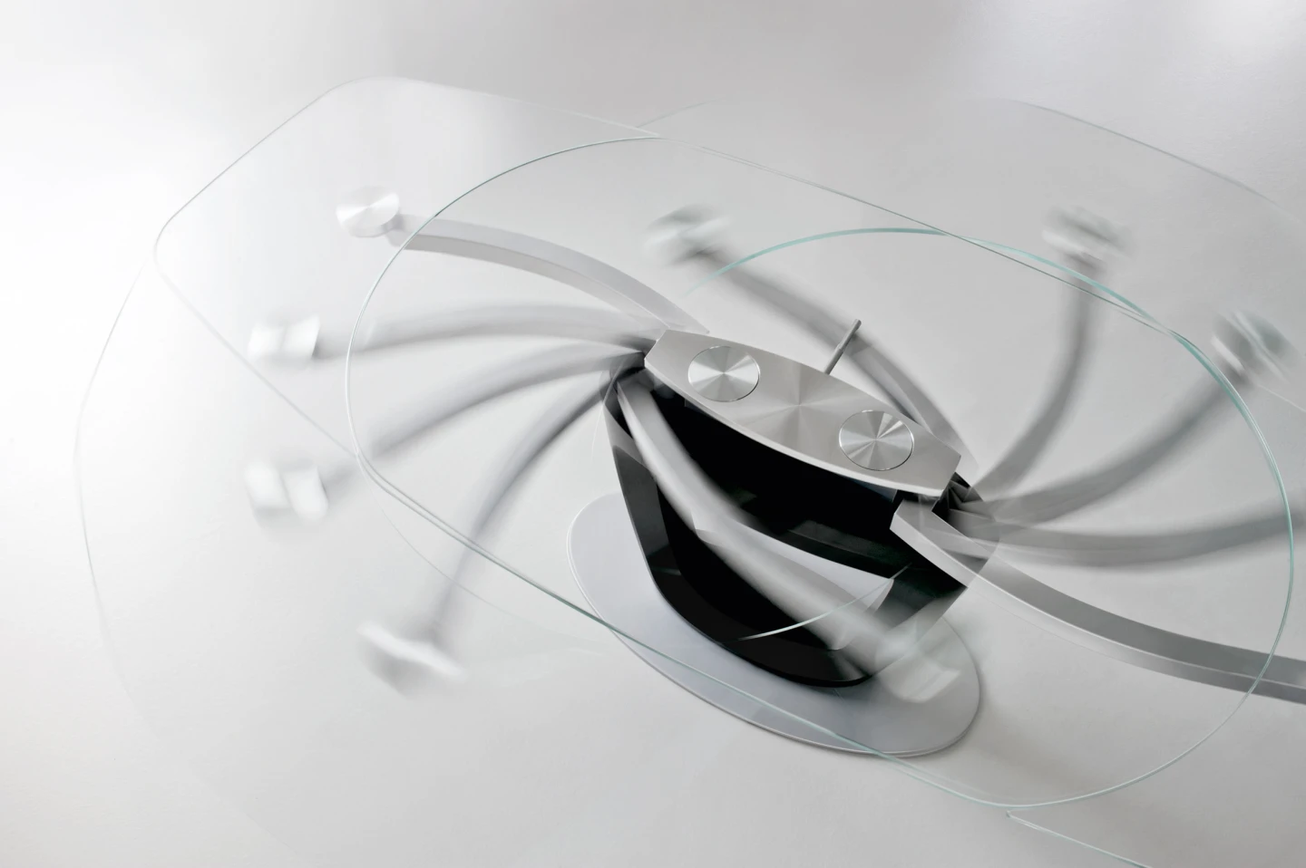 The glass top on the 2011 Calligaris Orbital table reveals its innovative extension mechanism