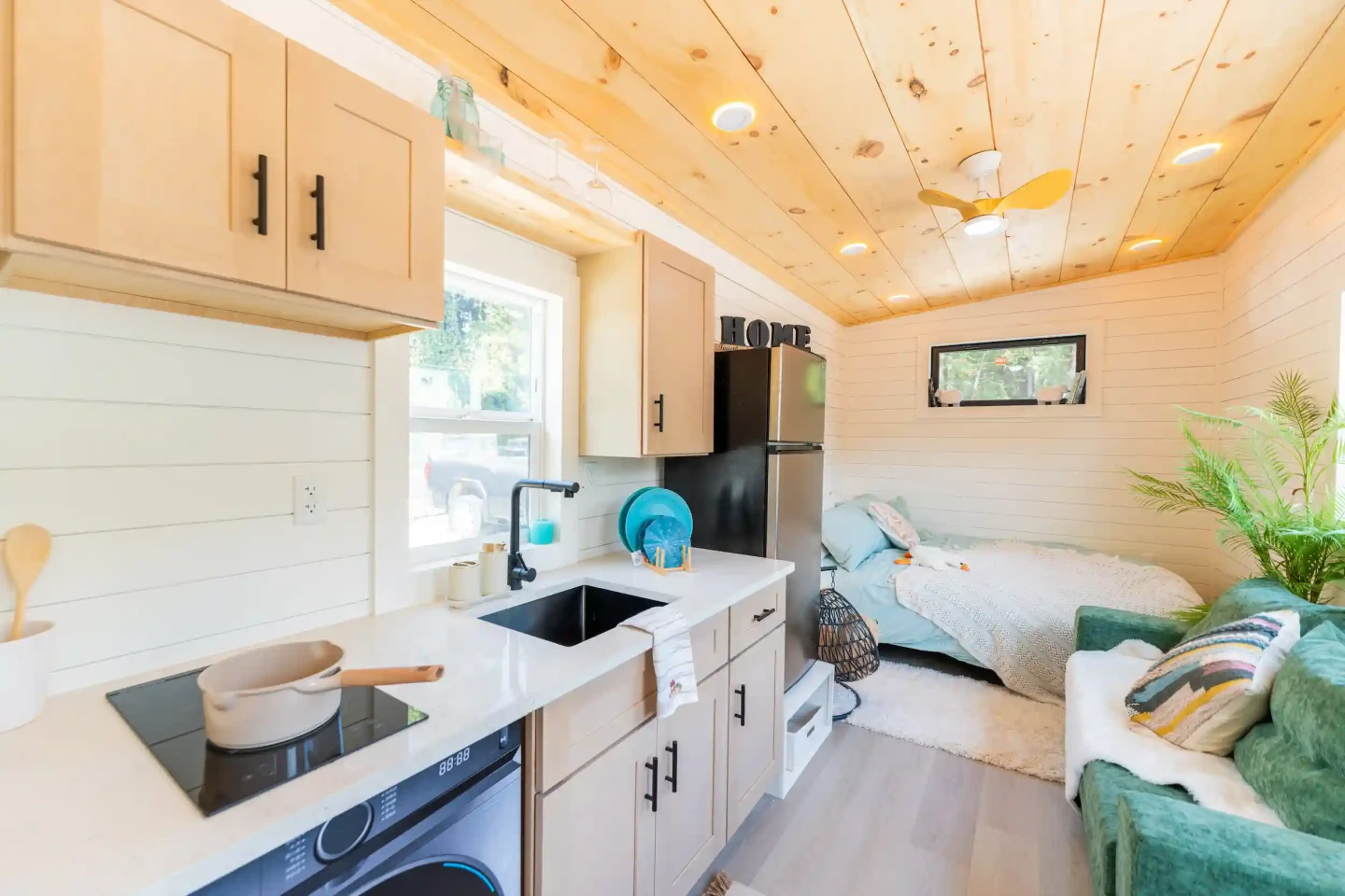 The Fairfax 20' has an open-plan living area combining the kitchen, living room, and bedroom