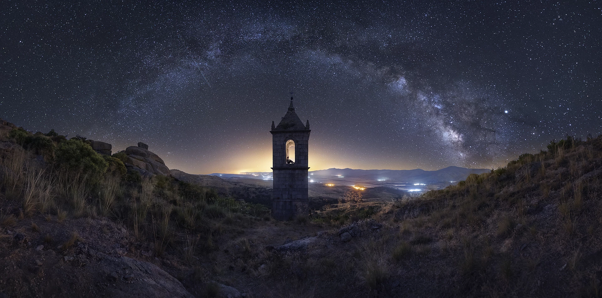 Enchanted Monastery, shot in Ávila, Spain. A 500-year old bell tower is the centerpiece of this image, illuminated with a soft glow from within, behind and above.