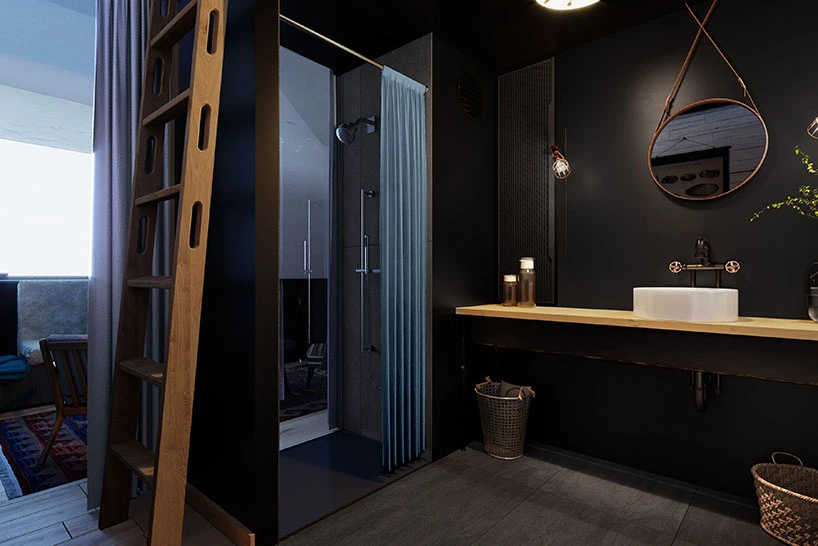 A ladder leads to the elevated bedroom