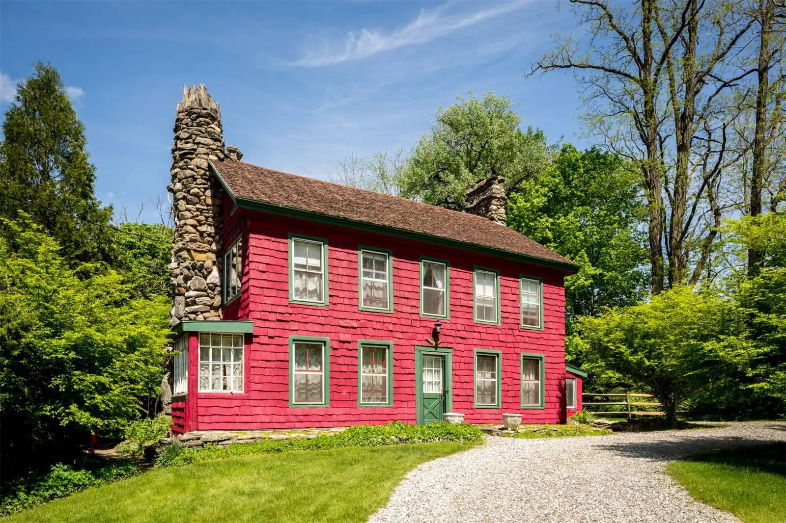With stain glass windows, a multi-color roof and forest-like gardens, the so-called Tyringham Gingerbread House wouldn’t look out of place in a fairytale
