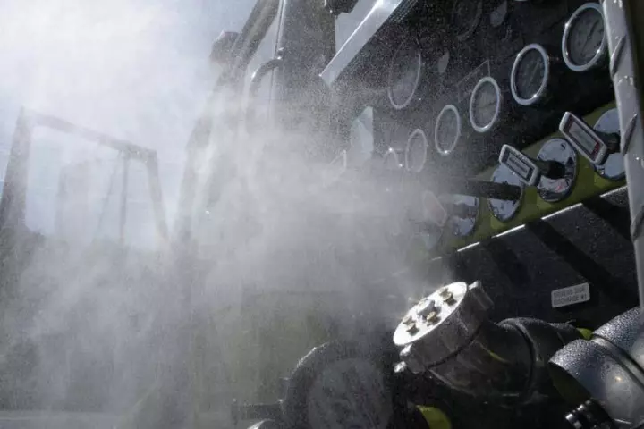The HeatSeeker is a cooling mister that replaces the existing hose port cap on a fire truck